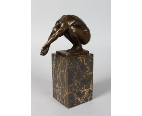 MILO A BRONZE DIVER.  4ins high. Signed, on a marble base.