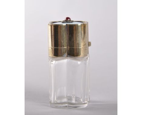 A VERY GOOD CLEAR GLASS LOBED SHAPED PERFUME BOTTLE, with silver top with pale blue enamel, cabochon ruby and rose diamonds, 