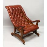 A GOOD STUDDED LEATHER CROSS FRAME ARMCHAIR.