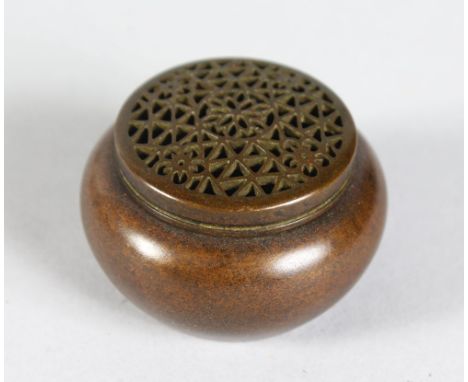 A TINY CHINESE BRONZE CIRCULAR CENSER AND COVER. Impressed mark.  1.5ins diameter.