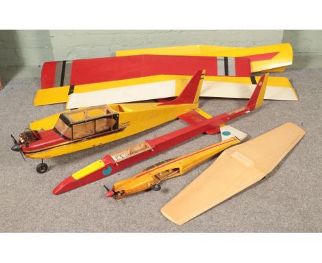 Three remote control kit model airplane gliders along with collection of glider wings.  