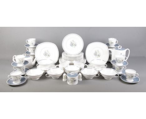 A comprehensive Susie Cooper Glen Mist dinner service. Containing cups and saucers, plates, salt and pepper shakers, bowls an
