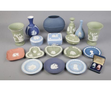 A collection of Wedgwood Jasperware including trinket boxes, dishes, urns and rare dark blue ovoid beehive vase  