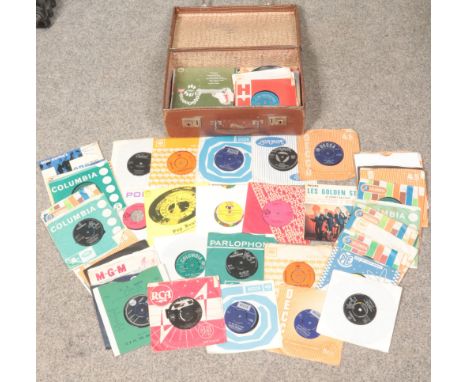 A vintage suitcase with over seventy singles, to include The Beatles, Tom Jones and Bob Dylan.  
