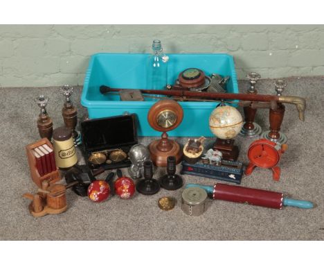 A good box of mixed collectables including wooden and ebonised candlesticks, desktop barometer, miniature globe, cast iron no