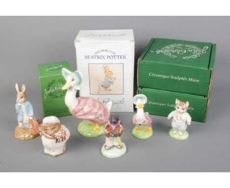 A collection of ceramic Beatrix Potter Peter Rabbit figures to include several boxed Beswick examples, Royal Albert Peter and