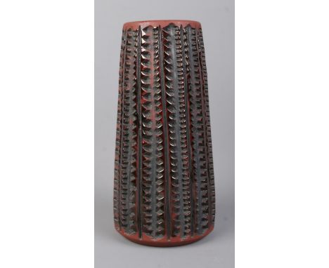 A Poole Pottery Atlantis vase of cylindrical form. Designed by Catherine Connett. Height: 20.5cm.  