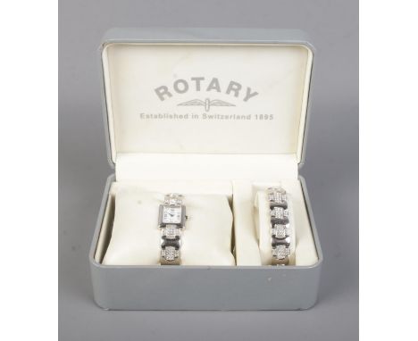 A ladies Rotary Elite wristwatch and bracelet set, both set with cubic zirconia stones on silver straps, stamped 925.  