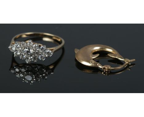 A 9ct gold cluster ring set with clear paste stones along with a single 9ct gold dolphin earring. Total weight 2.8g.  