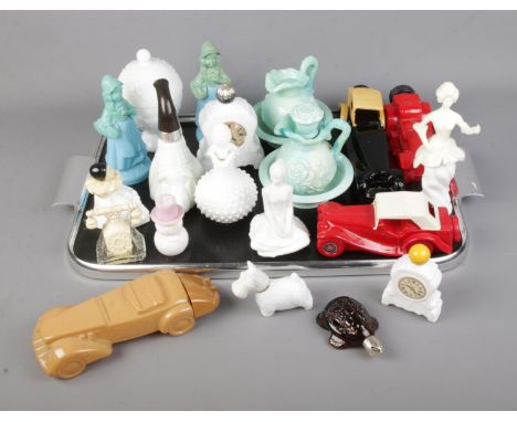 A tray of Avon novelty perfume and scent bottles to include car, clock, pipe and rotary phone examples.  
