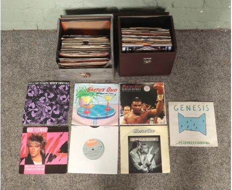 Two record cases of 7" singles mainly rock, to include Genesis, Status Quo, Rolling Stones and Rod Stewart with many more.  