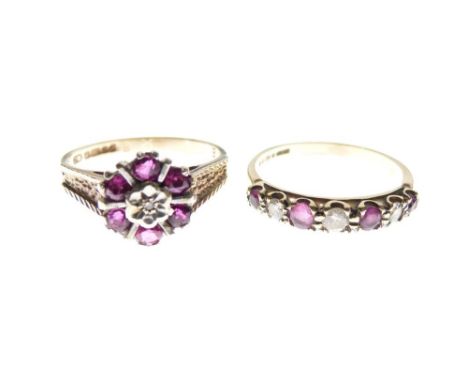 Two 9ct gold, diamond and ruby dress rings, the first of flowerhead design, the second a seven-stone ring of three diamonds a