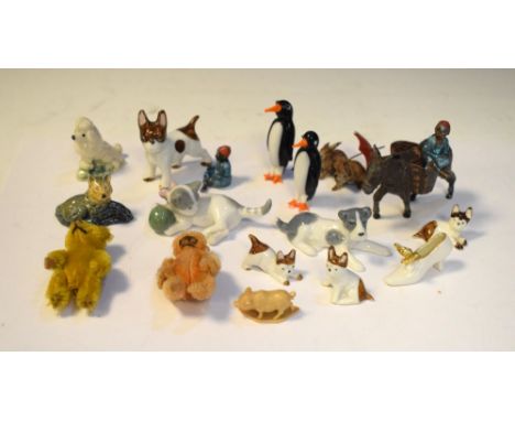 Group of mainly ceramic animal ornaments to include penguins, cats, dogs, etc  