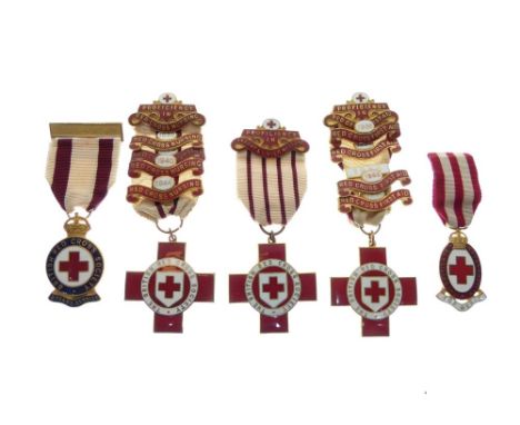 Five British Red Cross Society enamel badges awarded to E. Clarke, with various clasps for Red Cross First Aid in the 1930's/