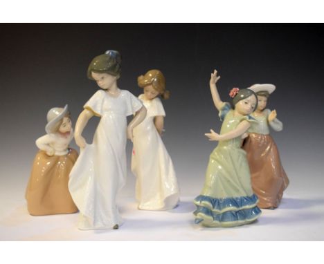 Four Nao porcelain figures - Flower Girl and Two girls in white dresses, together with Lladro dancer, tallest measuring 21cm 
