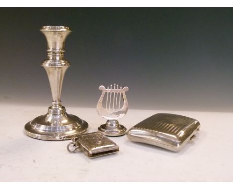 George V silver menu holder in the form of a lyre, Birmingham 1912, together with an Edward VII silver candlestick, Birmingha