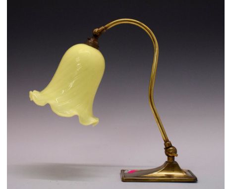 Art Nouveau-style brass and milk glass table lamp with pale yellow glass bell shaped shade, 33cm high  