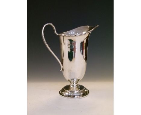 George V silver cream jug of helmet form, London 1932, 13.5cm high, 3.7toz approx  