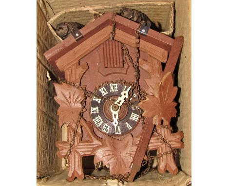 A late 20th century Tourist Type Cuckoo Clock, a Gurkha type dagger, an electric oak surgery bell, a rusty wire bottle carrie