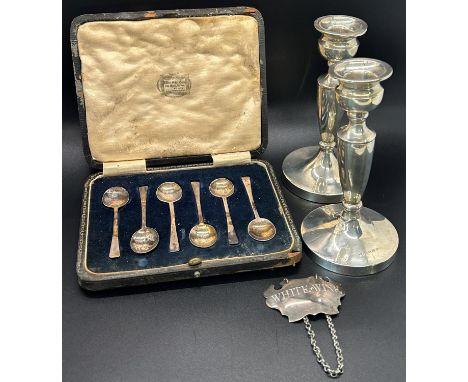 Five Reid &amp; sons silver forks, a pair of silver candlesticks, 13.5cm high, a cased set of silver espresso spoons, a white