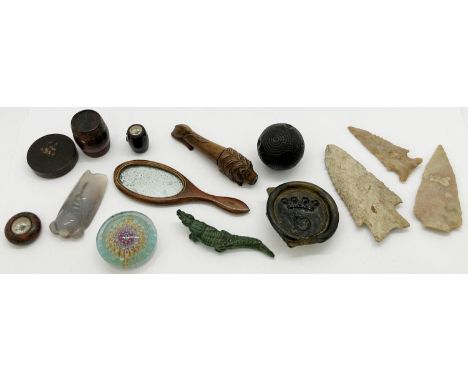 19th century treen whistle in the form of a lion, three flint arrow heads, further small treen items 