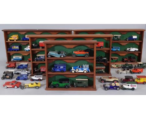 4 wooden freestanding shelf units displaying approx 60 models mainly Matchbox and Lledo promotional vehicles 