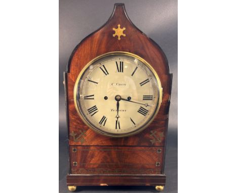 A regency period mahogany bracket clock the case with ogee outline and repeating inlaid brass detail, marked C (Cyrus) Crewe,