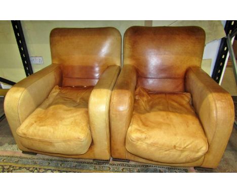 A pair of club armchairs, art deco period, in a light tan coloured leather 