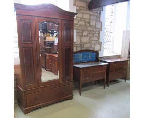 A good quality inlaid Edwardian mahogany wardrobe with mirror panelled door over a single frieze drawer on brackets supports 