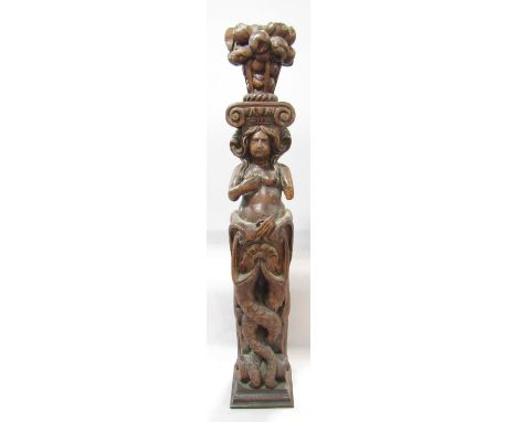 An 18th century oak carving of a mystical mermaid figure, flat back, possibly from a fire surround or bed post, damage to the