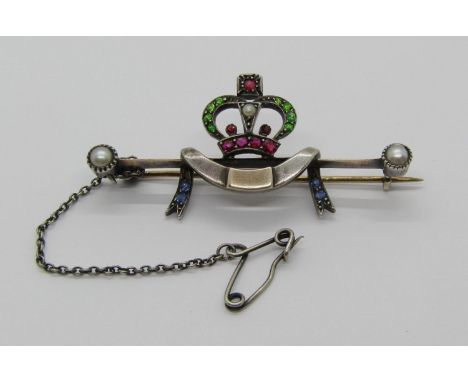 A Victorian or later precious metal and demantoid garnet, ruby, sapphire and pearl set bar brooch, in the form of a crown ove