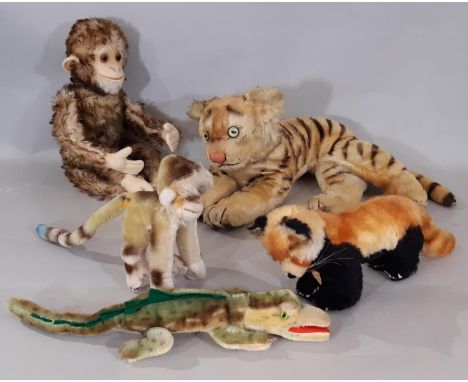 A collection of vintage Steiff jungle animal toys including 1960's 'Mungo' Monkey and 'Pandy' Red Panda both with chest tag a