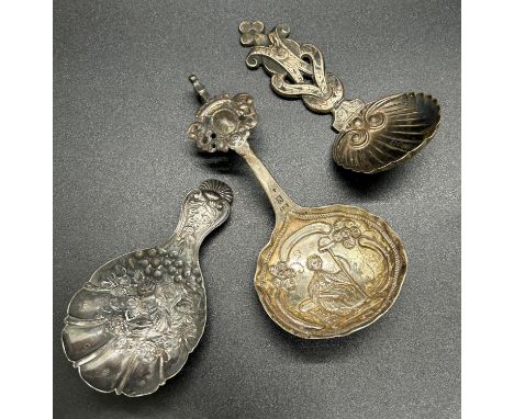 A George IV scalloped and floral embossed caddy spoon, Birmingham 1826, maker Joseph Wilmore, with later Victorian scalloped 