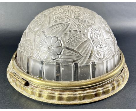 An Art Deco Hettier &amp; Vincent pressed glass ceiling lamp with floral decoration held in a hinged brass ring (lacks lockin