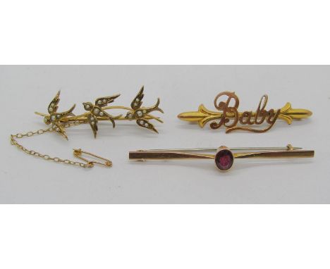 Three antique 9ct brooches comprising a seed pearl swallow example, a garnet example and a 'Baby' example, 6.2g total 