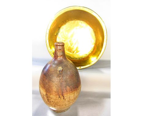 A salt glazed bellarmine jar lacking handle and cracked, 46 cm tall and a brass circular basin, 50 cm diameter 