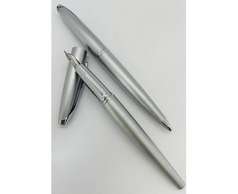 Sheaffer gold plated fountain pens with engine turned detail (in a cross box) a cross fountain pen and roller ball pen in a c