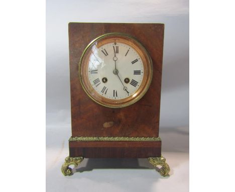 19th century mantle clock in a figured mahogany case enclosing an eight day striking movement with further brass mounts, toge