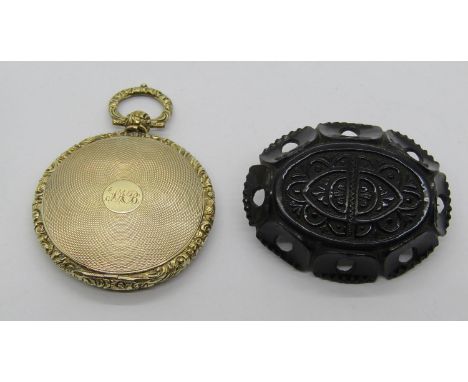 Antique engine turned yellow metal picture fob, 22.2g, plus a Victorian carved Whitby jet brooch (2) 