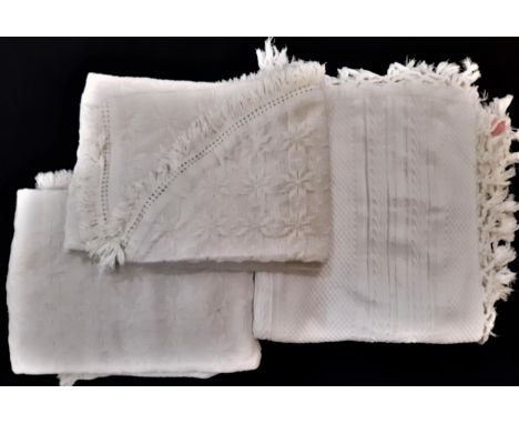 A pair of vintage cream fringed single bedspreads in patterned weave 150x230cm excl fringe, curved at foot, together with a w