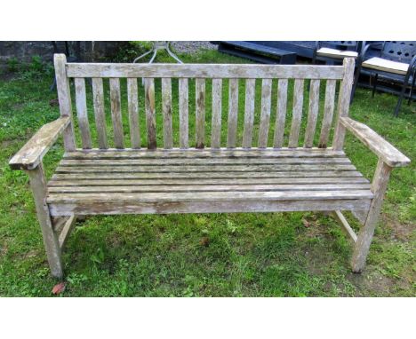 A Bramble Crest weathered teak three seat garden bench with slatted seat and back with curved splats, 160cm long 