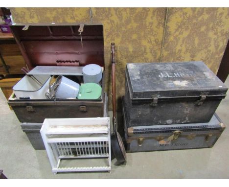 An old tin trunk containing various kitchenalia, a small painted plate rack, two further tin trunks and a cabin trunk (collec