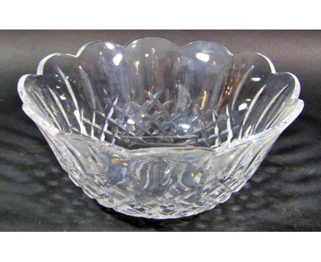 A Waterford 23cm diameter crystal glass fruit bowl in its original box, a bohemian red cut glass vase, a slender Dartington g