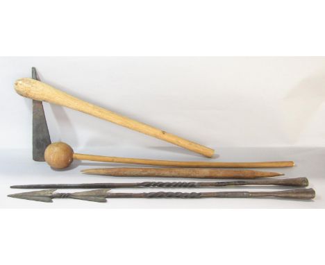 A collection of Southern African tribal weapons including two knob kerrie, an axe, two wrought iron spear shafts and a double