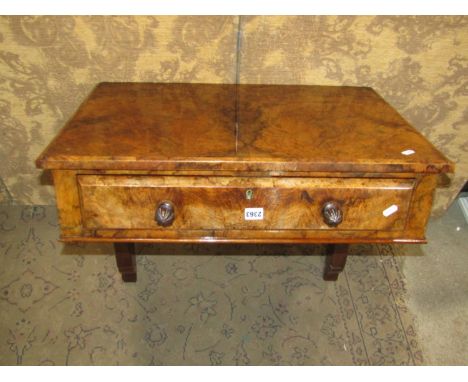 A Victorian figured walnut table enclosing a frieze drawer on shaped and pierced bracket supports, 70cm wide x 48cm deep 