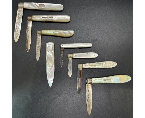 A collection of seven mother of pearl and silver fruit knives, various makers, together with a mother of pearl book mark 