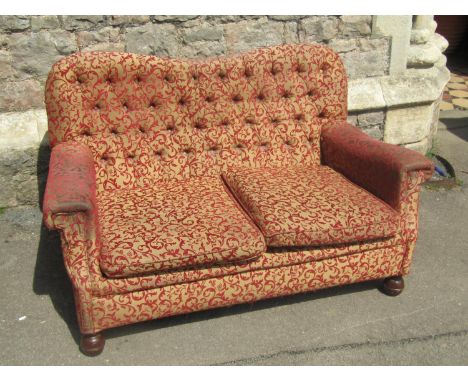 An Edwardian button back drawing room sofa of small proportions 130 cm wide together with a chair in  matching upholstery 