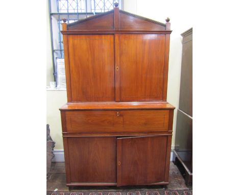 A 19th century continental secretaire bookcase, the lower section enclosed by a pair of panelled doors, the secretaire with f