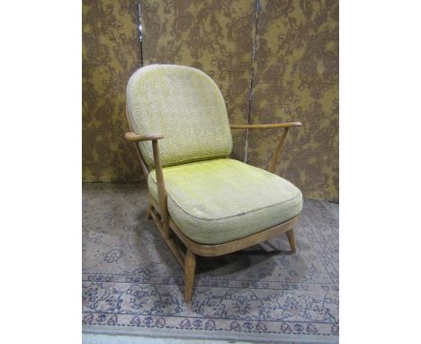 An Ercol Windsor stickback drawing room chair with turned supports 