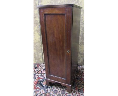 A 19th century mahogany collector’s coin cabinet enclosing nine graduated drawers with panelled door on bracket supports, 32c